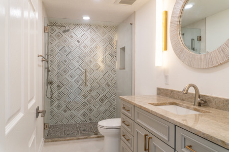 Geometrical Designed Showers w/ Taj Mahal Countertops: Bathroom Remodel