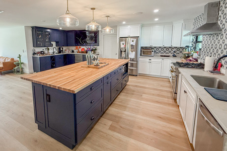 Modern Kitchen Remodel with Bold Backsplash and Blue Island