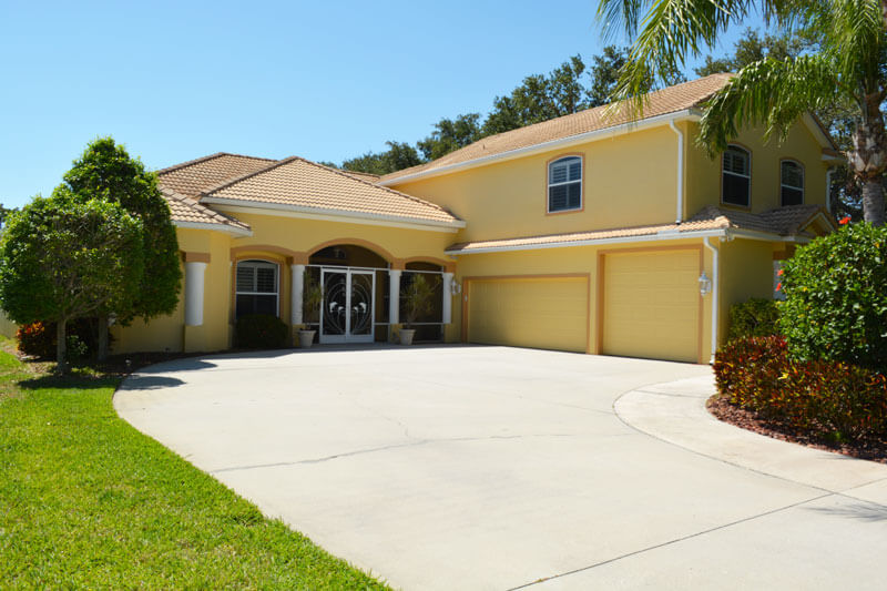 Front view of large yellow house